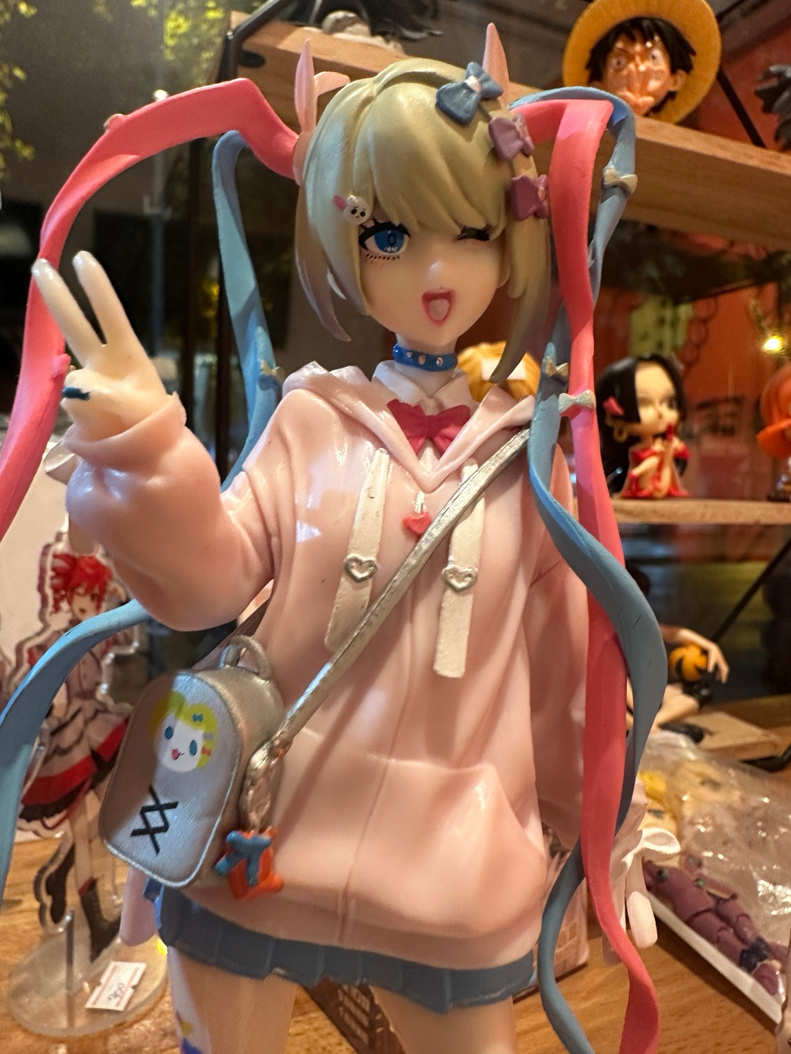 KAngel figure closeup of winking face and bow accessories