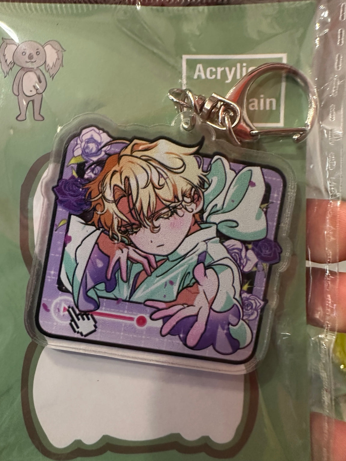 Blond anime character with purple roses video player acrylic keychain