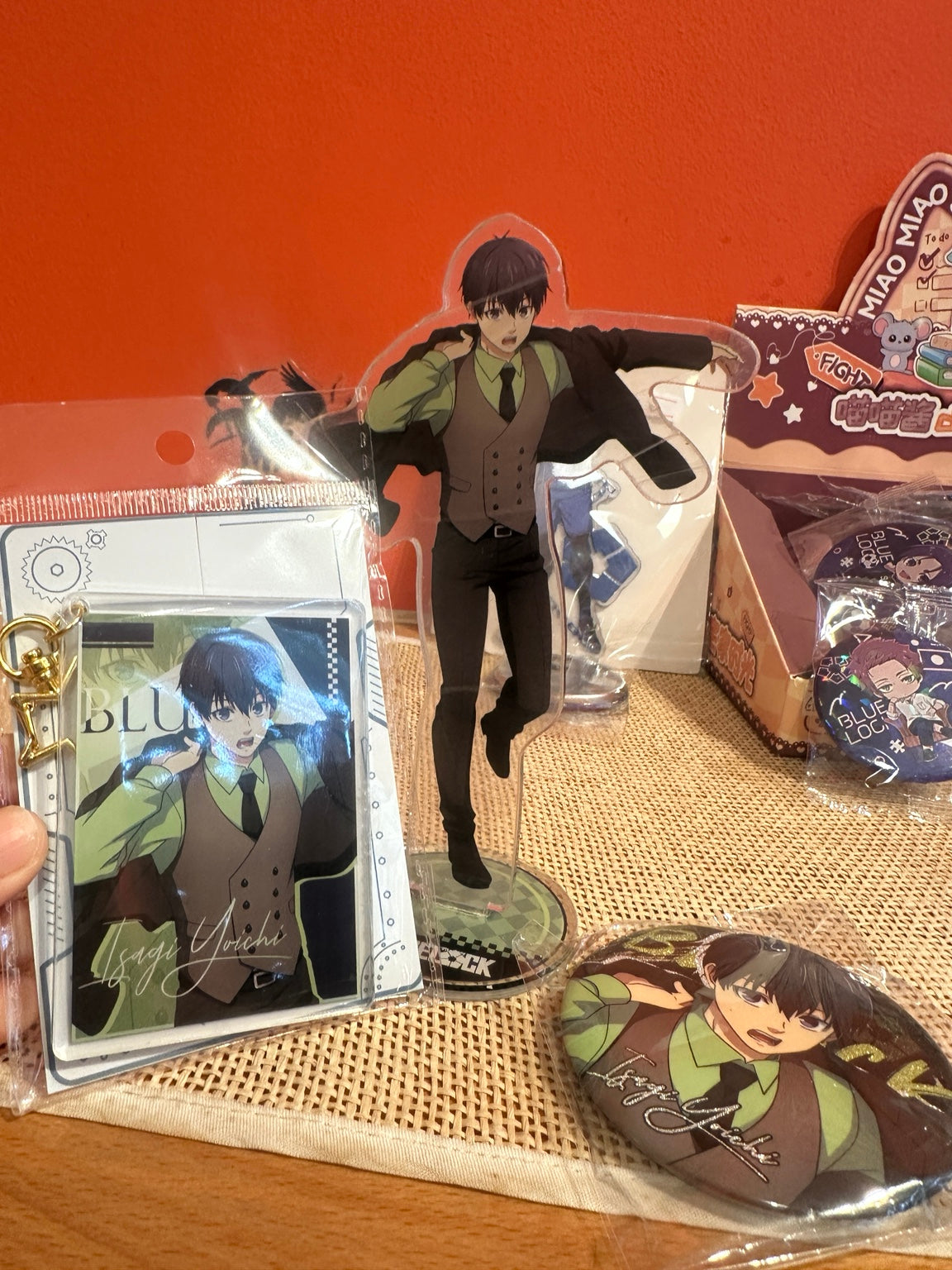 One bag with all 3 Blue Lock Isagi items together: acrylic standee, acrylic photo keychain and round badge