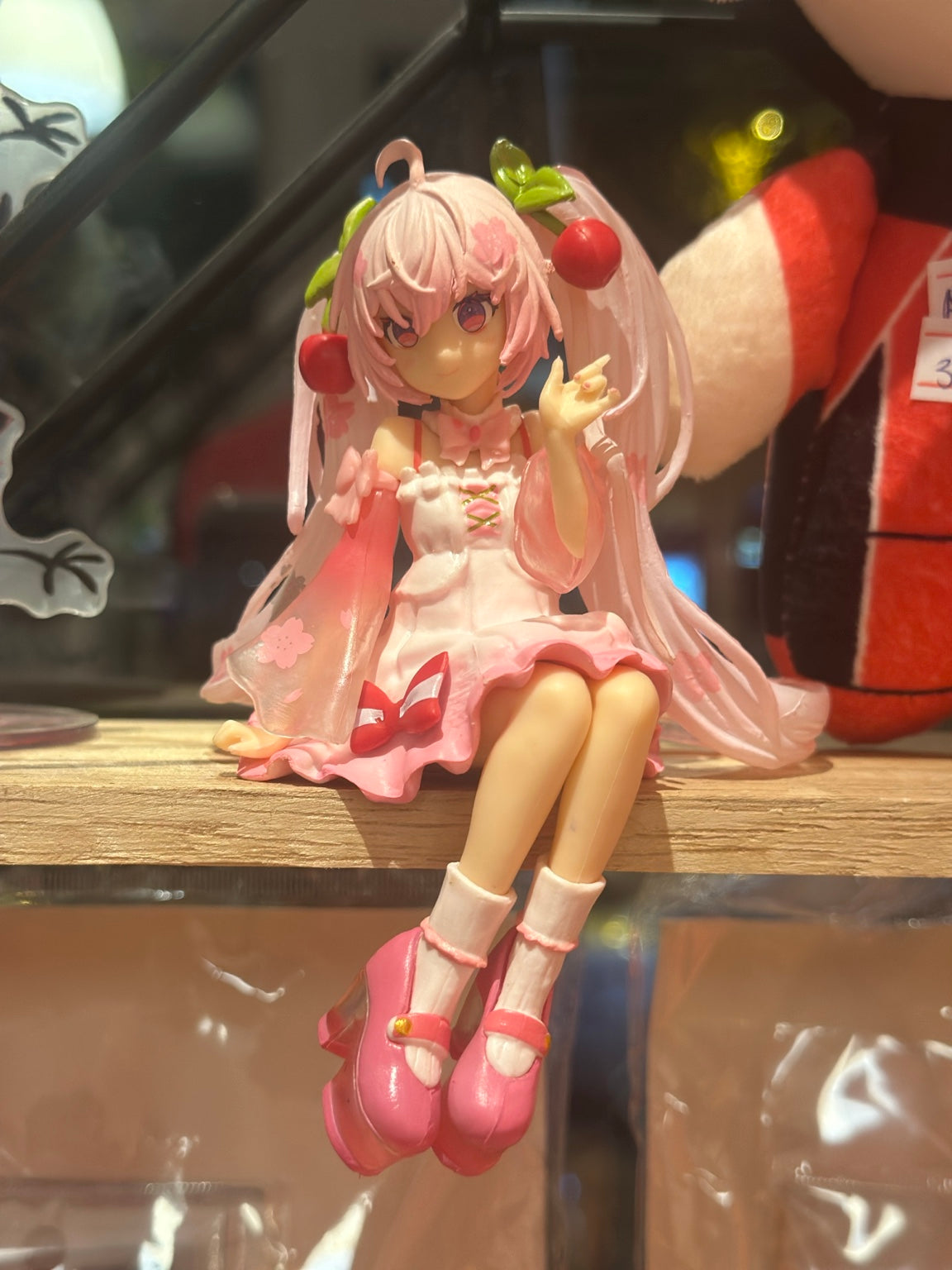 ANF-074 | Pink Cherry Blossom Anime Girl Sitting Figure – Shelf Edge