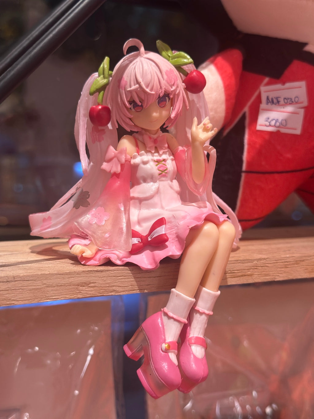 ANF-074 | Pink Cherry Blossom Anime Girl Sitting Figure – Shelf Edge